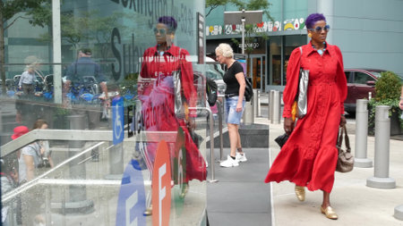 New York City, United States - 11 Sept 2023: Manhattan Midtown Lexington avenue, United States. People pedestrian exit underground subway station, stairs on 53 street, urban USA. Metro entrance sign.のeditorial素材