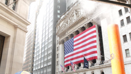 New York City, United States - 9 Sept 2023: Lower Manhattan Downtown Financial District architecture. Huge big American flag. Wall street Stock Exchange building, USA Stock Market. Steam smoke stack.のeditorial素材