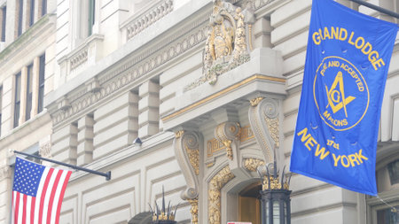 New York City, United States - 6 Sept 2023: Grand Lodge of Masons building facade, Manhattan street. Freemasons headquarters architecture. Masonry organization in NYC, USA. Masonic Hall exterior. Flagのeditorial素材