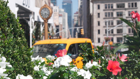 New York City, United States - 6 Sept 2023: Manhattan Midtown Broadway, 23 street, 5 avenue crossroad intersection. Worth Square near Madison Park and Flatiron Building, USA. Porcelanosa, taxi, clock.のeditorial素材