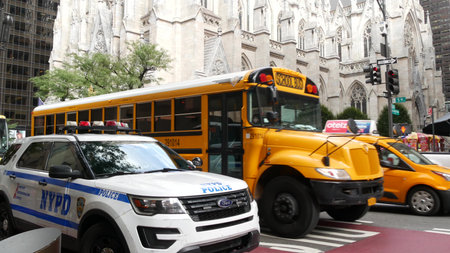 New York City, United States - 8 Sept 2023: Yellow School Bus on Manhattan street, schoolbus and...