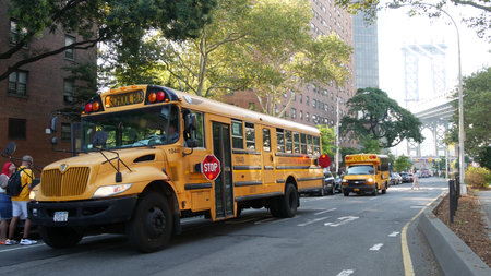 New York City, United States - 7 Sept 2023: Yellow School Bus, Manhattan bridge, schoolbus truck,...