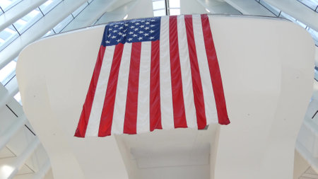 New York City, United States - 10 Sept 2023: World Trade Center Oculus architecture. Manhattan Downtown Financial District, USA. September 11 remembrance, large memorial american flag. 911 Patriot dayのeditorial素材