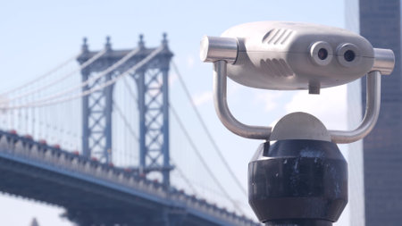 New York City, United States - 30 Aug 2023: Manhattan Bridge lookout, tower viewer binoculars, Brooklyn telescope viewpoint, Dumbo tourist landmark. East River John street park promenade. Travel USA.のeditorial素材