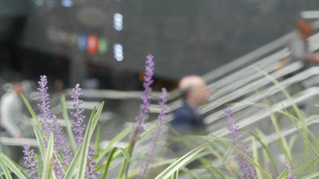 New York City, United States - 11 Sept 2023: Manhattan Midtown Lexington avenue, United States. Defocused people pedestrian, underground metro subway station, stairs on 53 street, urban USA. Greenery.のeditorial素材