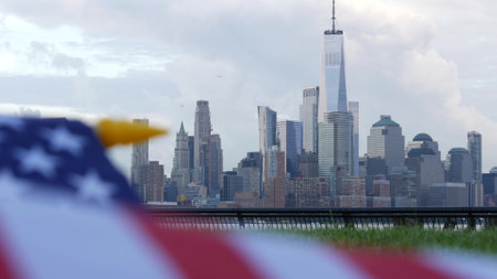 New York City, United States, 11 September 2023: Waterfront skyline, Manhattan Downtown World Trade Center skyscraper. Cityscape from New Jersey. American flag. USA independence and remembrance symbolのeditorial素材