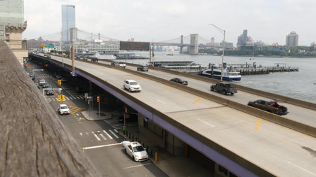 New York City, United States - 30 Aug 2023: Waterfront road, Manhattan Downtown financial district riverfront from Elevated Acre. Highway along East river, cars on waterside FDR drive. Brooklyn Bridgeのeditorial素材