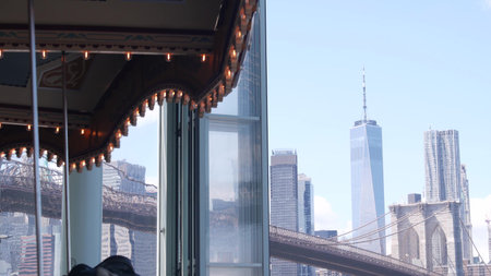 New York City, United States - 30 Aug 2023: Brooklyn Bridge, Manhattan downtown skyline architecture, financial district cityscape. World Trade Center WTC skyscraper. Dumbo waterfront vintage carouselのeditorial素材