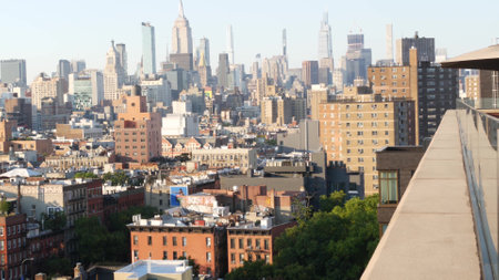 New York City, United States - 7 Sept 2023: Manhattan skyline cityscape. Empire State Building. Rooftop, residential house roof. Real Estate, urban street architecture, Midtown district, East Village.のeditorial素材