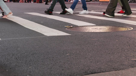 New York City, United States - 14 Sept 2023: Times Square, Manhattan Midtown Broadway street, USA. American NYC urban life. People pedestrians on zebra crosswalk. Road traffic. Low angle, legs or feetのeditorial素材
