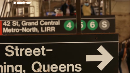 New York City, United States - 29 Aug 2023: Subway station interior, underground metropolitan platform. Public metro transport. Railway passenger traffic. Text sign: Grand Central, 42, Queens. People.のeditorial素材