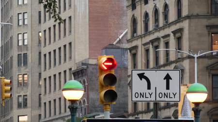 New York City, United States - 8 Sep 2023: Subway entrance globe, orb lamp. Yellow traffic light, Manhattan Midtown road intersection, street crossroad sign. Metropolitan underground metro transport.のeditorial素材