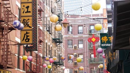 New York City, United States - 14 Sept 2023: Manhattan Chinatown Pell street. Chinese culture, ethnic district architecture, USA. Red brick buildings, paper lanterns and hieroglyph signs. Little Chinaのeditorial素材