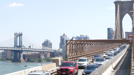 New York City, United States - 3 Sept 2023: Cars on Brooklyn Bridge, Manhattan Bridge and Dumbo view. Rush hour road traffic jam and architecture. Iconic landmark on East River. Travel USA.のeditorial素材
