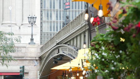 New York City, United States - 4 Sept 2023: Grand Central Terminal railway station, 42 street. American Manhattan Midtown. Bridge on Pershing Square, NYC, USA. Light bulb garland, umbrella and flowersのeditorial素材
