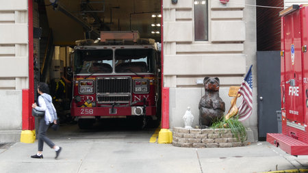 New York City, United States - 30 Aug 2023: NYFD car, USA fire department truck, american firefighters vehicle or fire fighter engine on NYC street. Firemen station red gates, FD house or hall. Queensのeditorial素材