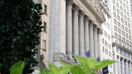 New York City, United States - 3 Sept 2023: Manhattan Downtown Financial District urban architecture. American flag. Wall street Stock Exchange building facade columns, USA Stock Market trading, NYC.のeditorial素材