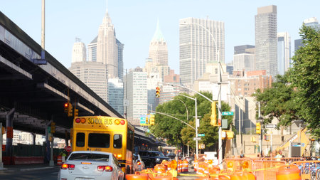 New York City, United States - 7 Sept 2023: Yellow School Bus on street, schoolbus truck on city...