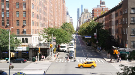 New York City, United States - 1 Sept 2023: Chelsea urban architecture from High Line, Manhattan Midtown street, 10 avenue. American red brick residential buildings, cars traffic on road, yellow taxi.のeditorial素材