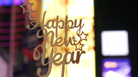 Happy New Year text sign on Times Square in New York City, United States. Illuminated screens during...