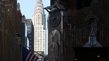 New York City, United States - 9 Sept 2024: Manhattan Midtown. Gothic General Electric building, terracotta art-deco skyscraper tower architecture, Lexington avenue, Turtle Bay, American USA flag.のeditorial素材