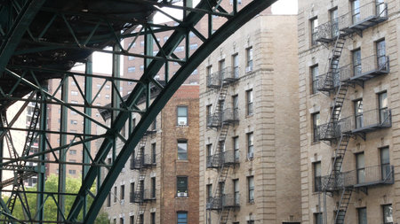 New York City 125 street elevated subway metro metallic bridge in Harlem, United States. American...