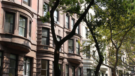New York City townhouse buildings, brownstone row houses in Manhattan or Brooklyn, United States of...