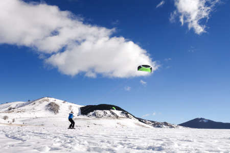 Snowkiting, on a beautiful sunny dayの写真素材