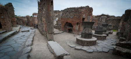 Pompeii bakery in the Street 
Pompeii is a ruined and partially buried Roman town-city near modern Naples in the Italian region of Campania, in the territory of the comune of Pompei.の写真素材