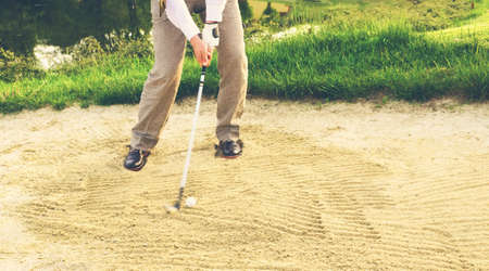 Businessman Golfer in Sand trapの写真素材