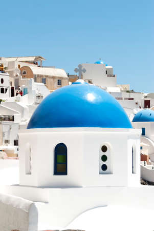 Greece, church with blue domes in oia town Santorini islandの写真素材