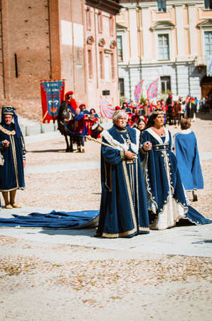 Asti, Italy - September 16, 2012: Couple of senior nobles in medieval costumes in historical parade on the day of the Palio in Asti, Italyのeditorial素材