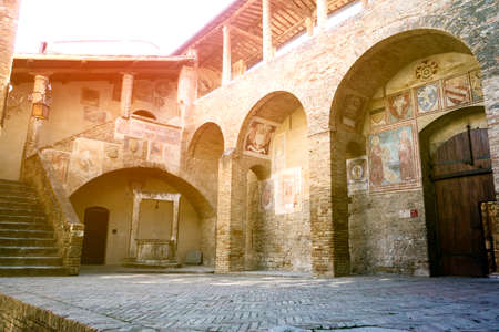 medieval courtyard in the small town San Gimignano in Tuscany, Italyのeditorial素材