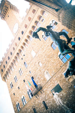 Michelangelo's David statue located in Piazza della Signoria in Florence, Italy.Palazzo Vecchio. Perseus statue with the head of Medusa , in Loggia de' Lanzi, Piazza della Signoria, Florence. Sculptor Benvenuto Cellini (1545-1554).Florence, Italyの写真素材