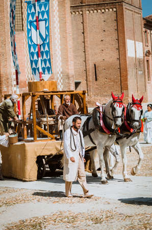 Asti , Italy 16 September 2012 : Working Machinery of horse-drawn cart in the historic medieval parade with more diemila appearing during the Palio of Asti in Piedmont, Italyのeditorial素材