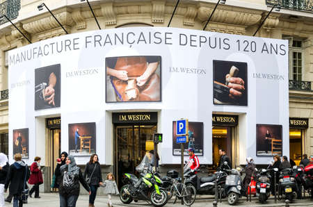 Paris, France 03/17/2012: People pass in front of the facade of JM Weston shop in champ elisee, Paris. JM Weston is a company of luxury footwearのeditorial素材