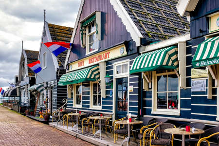 Volendam,  Netherlands , tourist restaurant on the pier in Volendam, cloudy spring day in Volendam fishing village north of Amsterdam.のeditorial素材