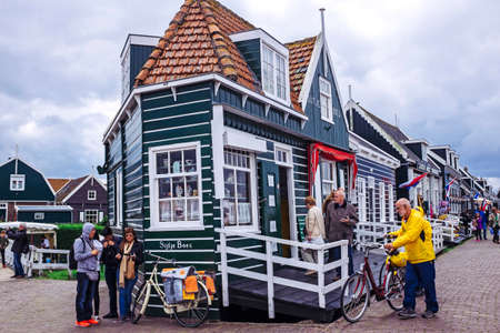Volendam, Netherlands - June 30, 2016: Netherlands, Tourists visit the village of Volendam, cloudy spring day in Volendam fishing village north of Amsterdam.のeditorial素材