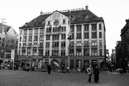 Amsterdam, Nwtherlands - June 15, 2016: Dam Square views with the museum Madame Tussauds in the background. urban scene in black and white of the most important square in the heart of Amsterdam cityのeditorial素材
