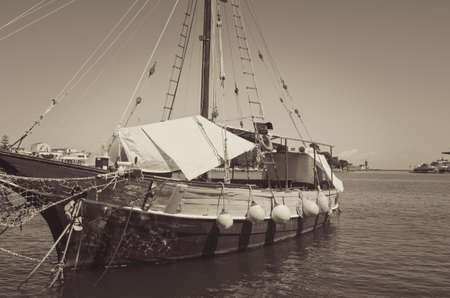 Old sailboat still in the harborの写真素材