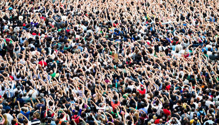 Crowd at a music concert, audience raising hands upのeditorial素材