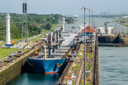 Panama City, Panama - February 20, 2015: Oil tanker ship entering the Miraflores Locks in the Panama Canal, Ships are raised above sea.のeditorial素材
