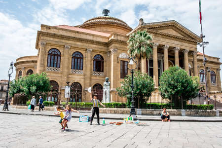 Palermo, Italy - April, 2018: Street artist making soap bubbles on the street in Piazza Giuseppe Verdi, in front of the opera house, Teatro Massimo.のeditorial素材