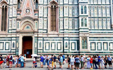 Tourists at Giottos bell tower at Cathedral of Santa Maria del Fiore in Florenceのeditorial素材