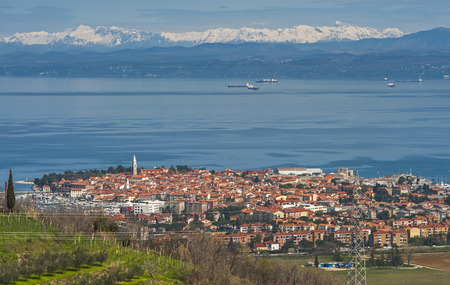 town Izola with the highest mountain in Slovenia in the background - Triglav.の写真素材