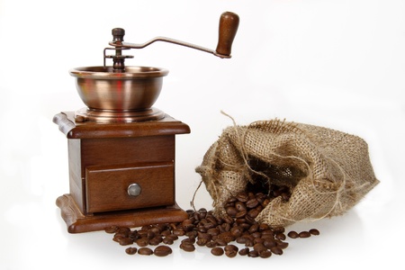 coffee mill with burlap sack of roasted beans の写真素材