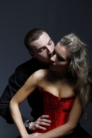 man kissing woman in her neck の写真素材