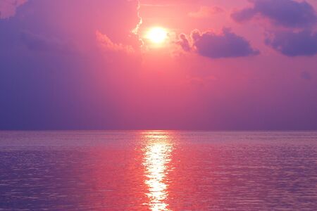 Evening scene with sunset on sea の写真素材