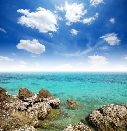 Sea Clear water and Stone beach blue sky paradise in Thailandの写真素材