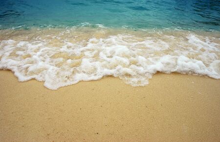 Beach wave sea sand sun water in thailand beach for background and designの写真素材
